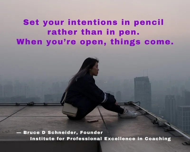 Person sitting on rooftop, inspirational quote displayed.