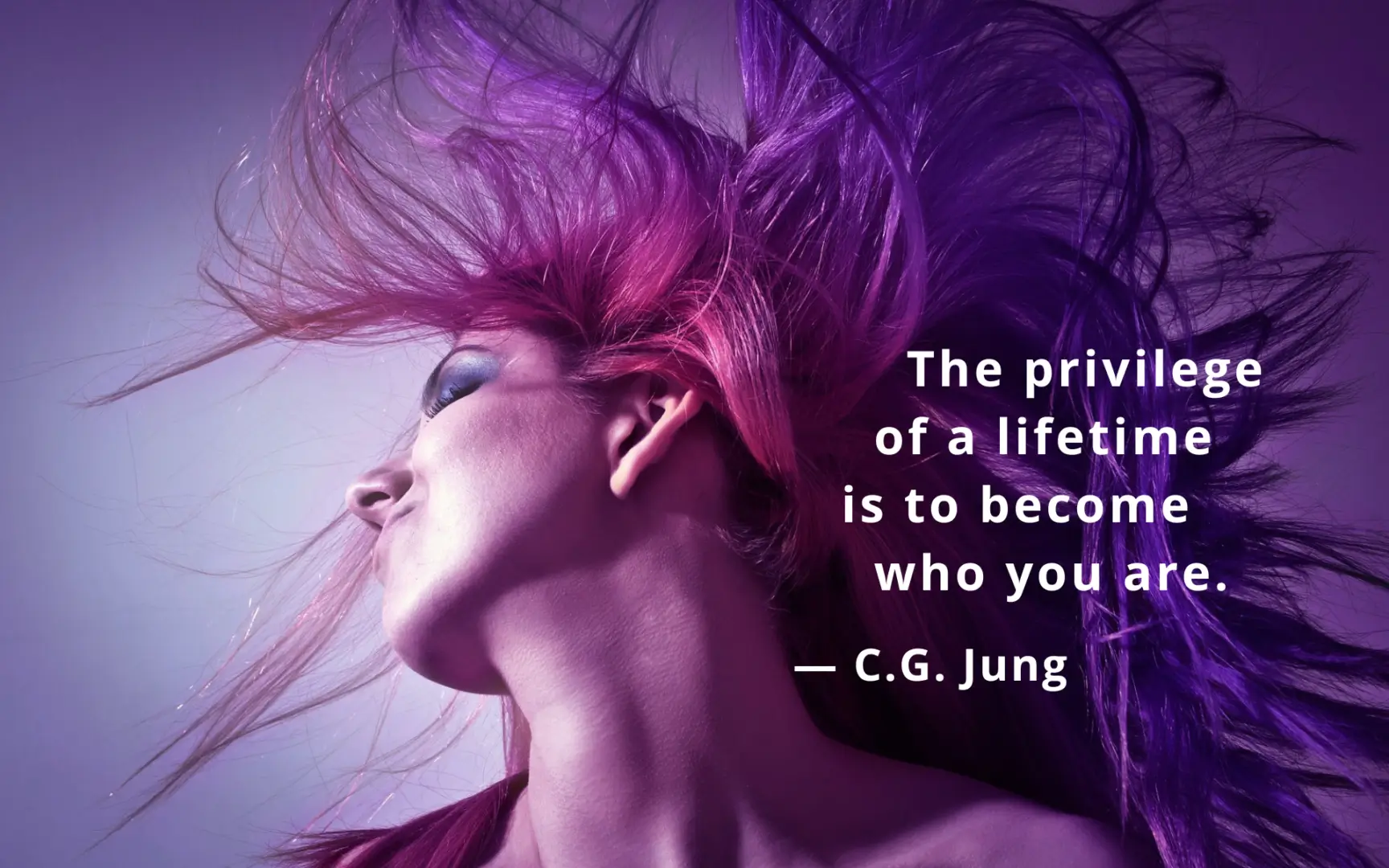 Person with vibrant hair and C.G. Jung quote.